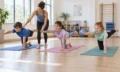 Children practising Pilates movements with an instructor